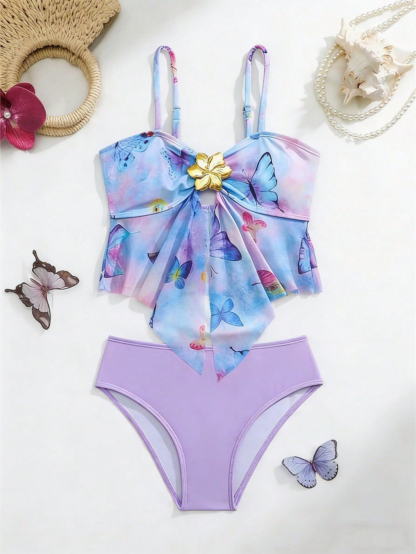 Tween girls two-piece tankini swimwear set with spaghetti straps, asymmetrical design, and 3D rose detail. Features a plant-pattern top and mid-waist bottoms in stretchy fabric for beach or pool wear.