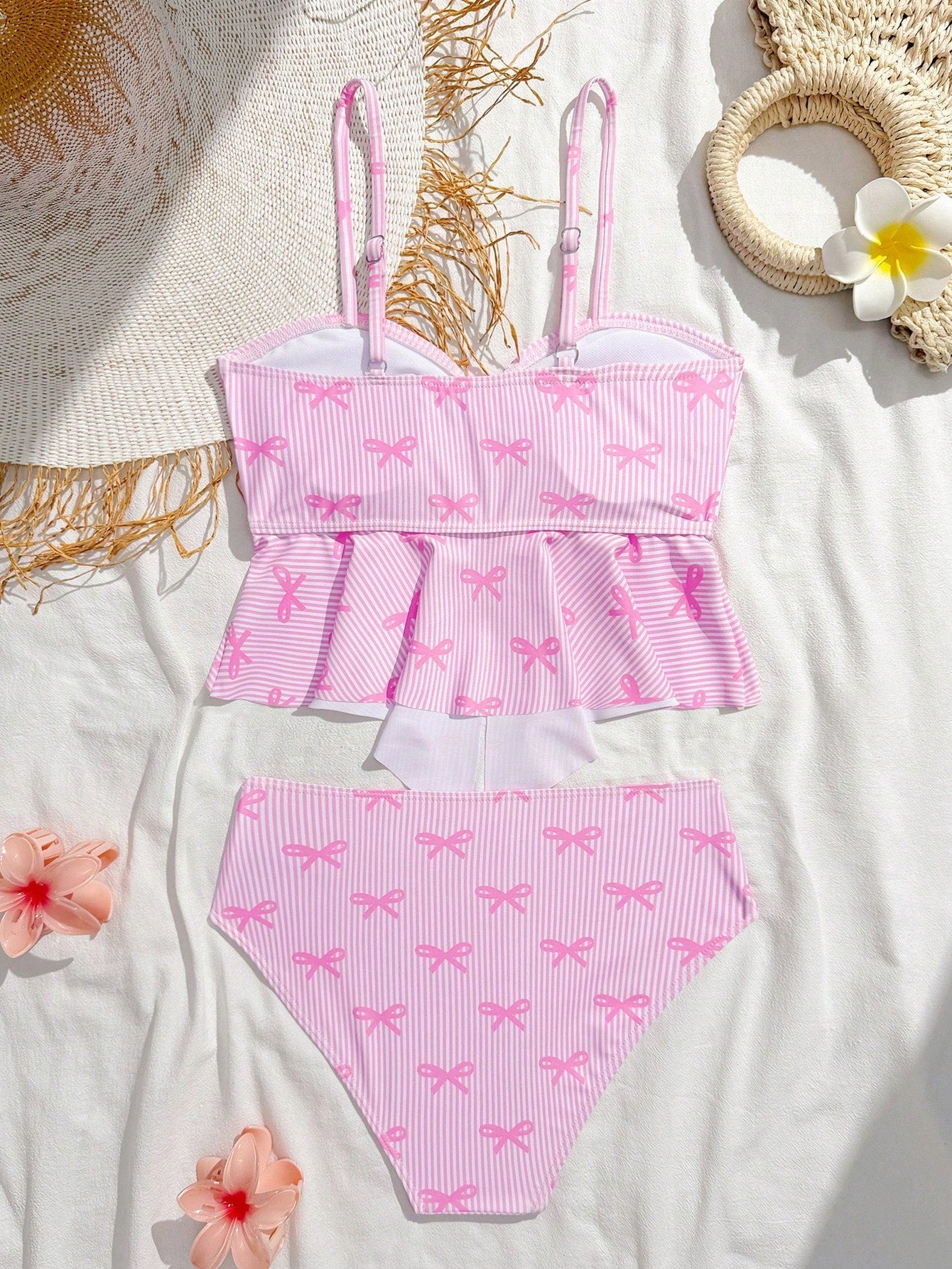 Tween girls two-piece tankini swimwear set with spaghetti straps, asymmetrical design, and 3D rose detail. Features a plant-pattern top and mid-waist bottoms in stretchy fabric for beach or pool wear.