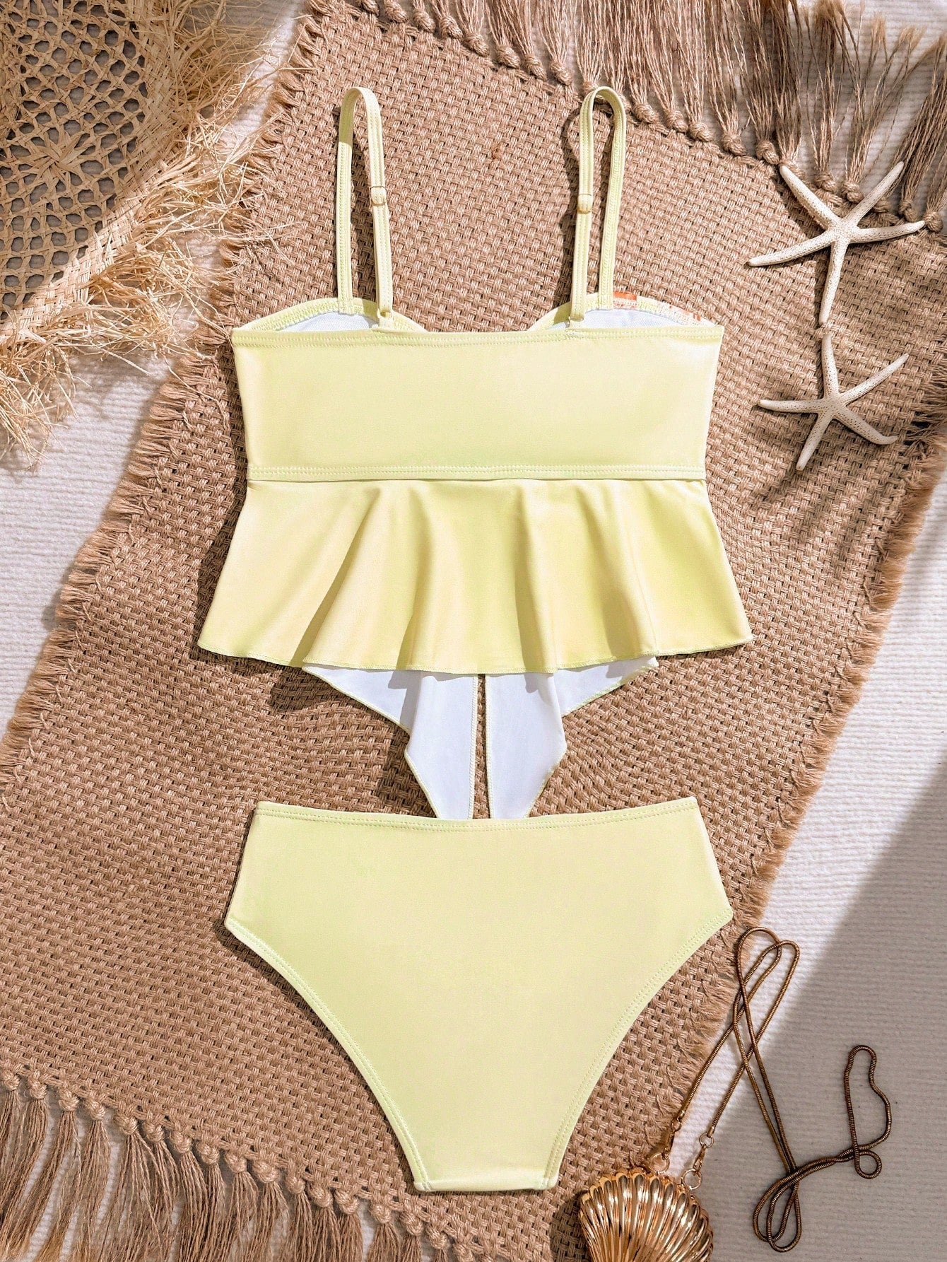 Tween girls two-piece tankini swimwear set with spaghetti straps, asymmetrical design, and 3D rose detail. Features a plant-pattern top and mid-waist bottoms in stretchy fabric for beach or pool wear.